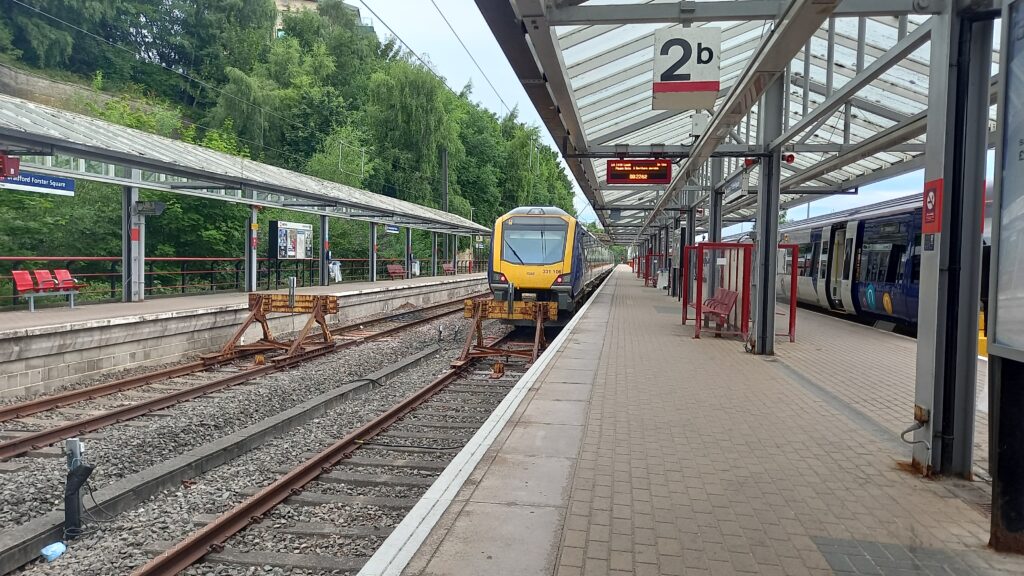 View of a Northern train sitting on Platform 2 at Bradford Forster Square
